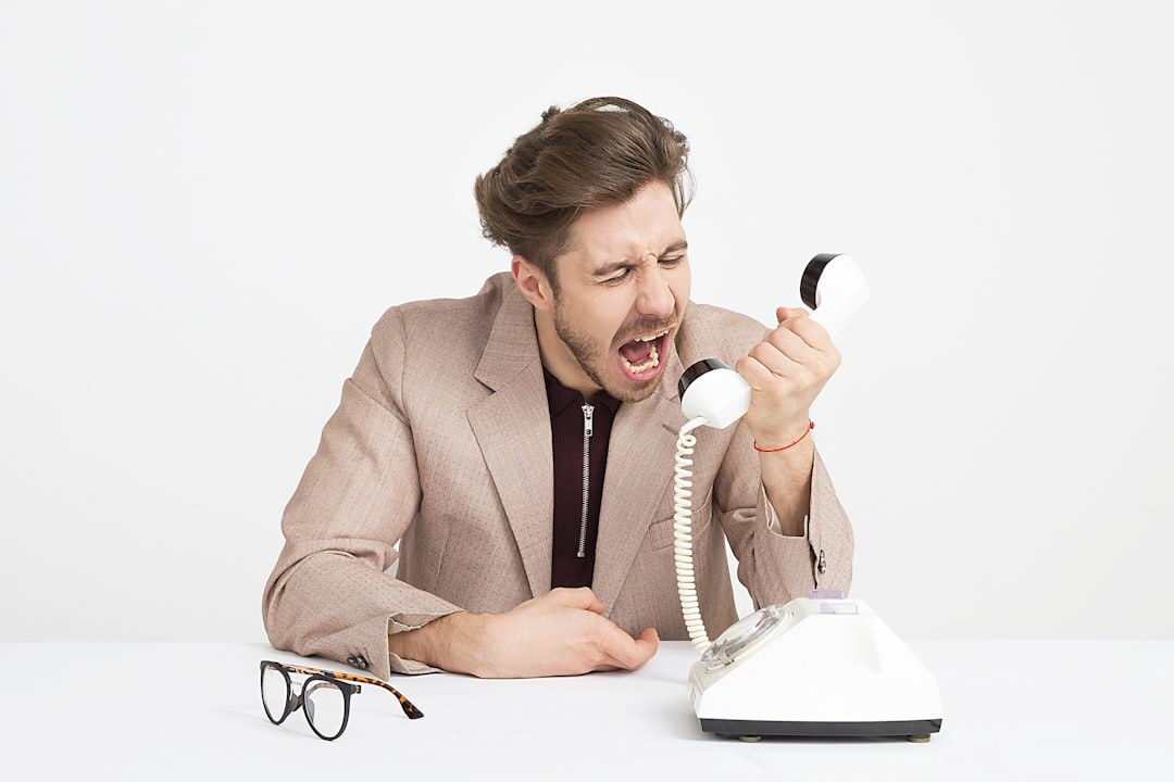 Friendly Dutch office employee answering the phone at a desk